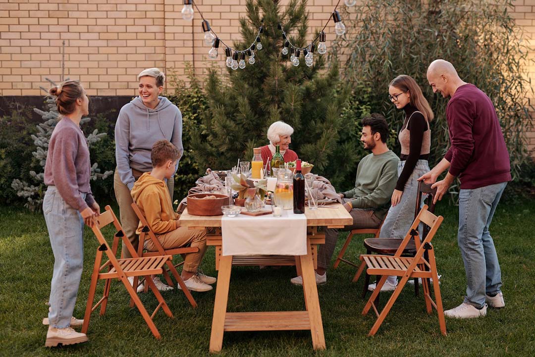 Family gathering at a picnic table