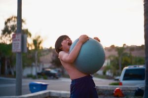 Child with yoga ball