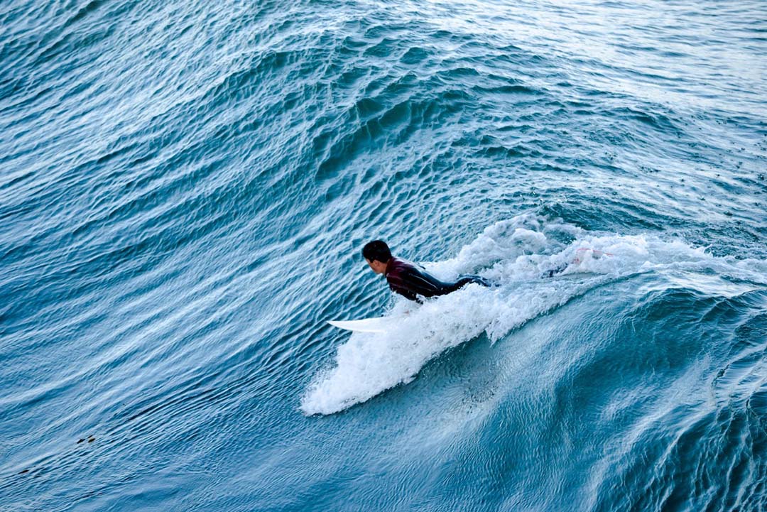 Surfer taking a wave