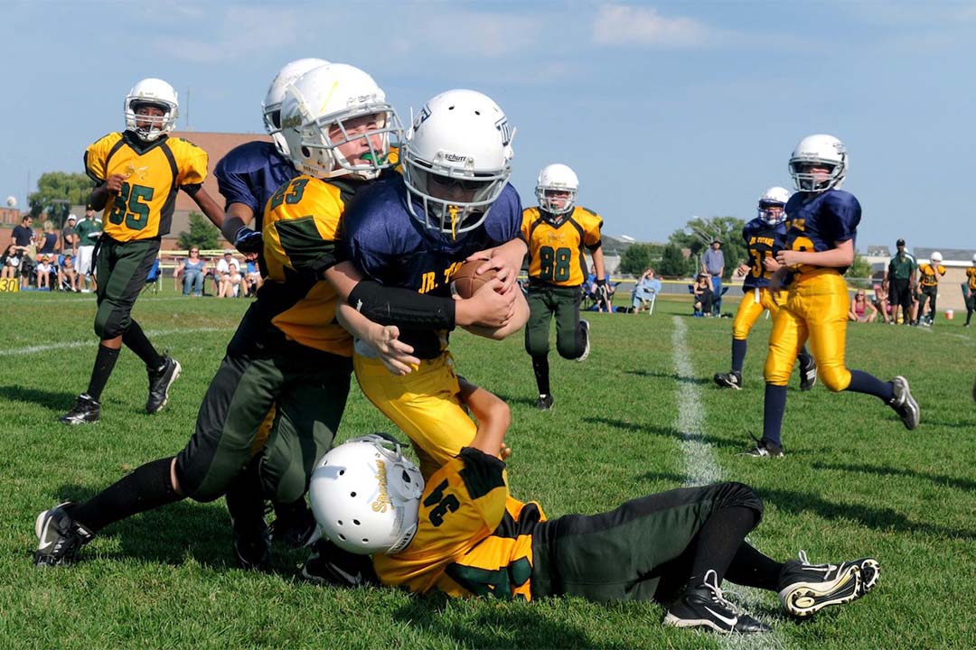 Children playing tackle football